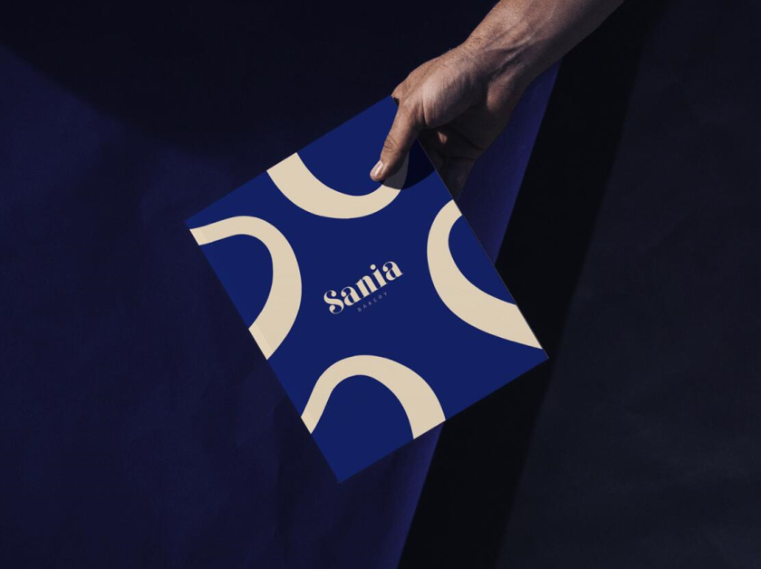 sania 烘培面包店品牌vi形象設計，寶藍色面包手繪線條輪廓圖案